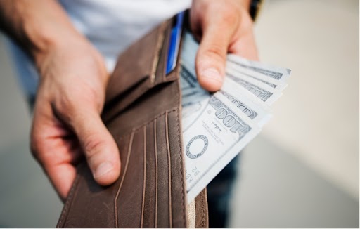 Wallet with money representing battery savings
